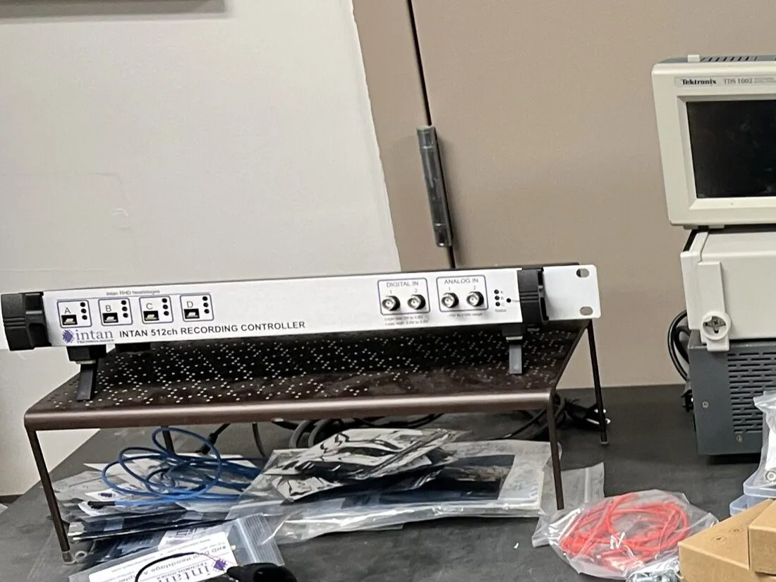 Intan 512-channel RHD electrophysiology recording controller on a laboratory bench.